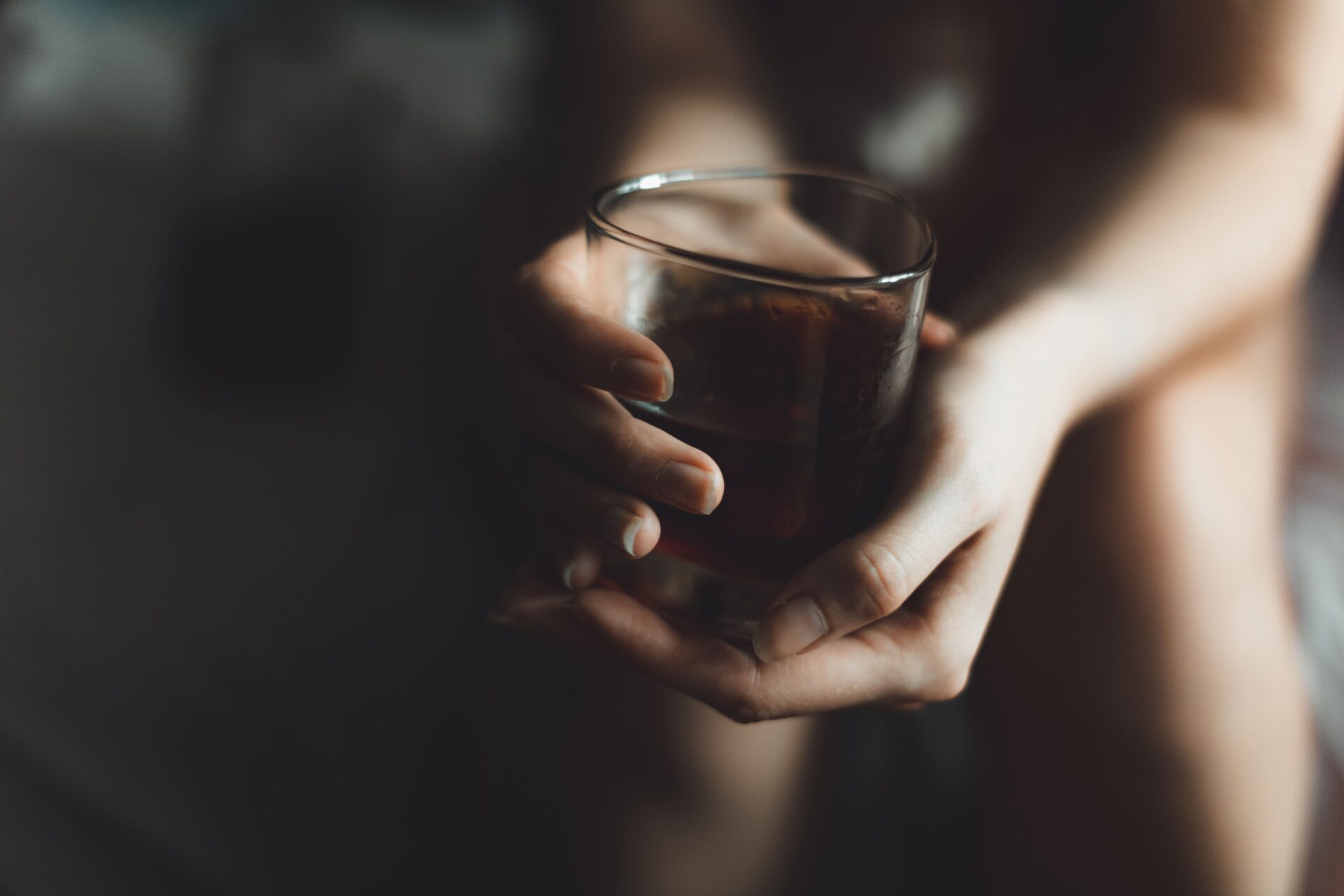 A woman wondering: Is alcohol a depressant or a stimulant?