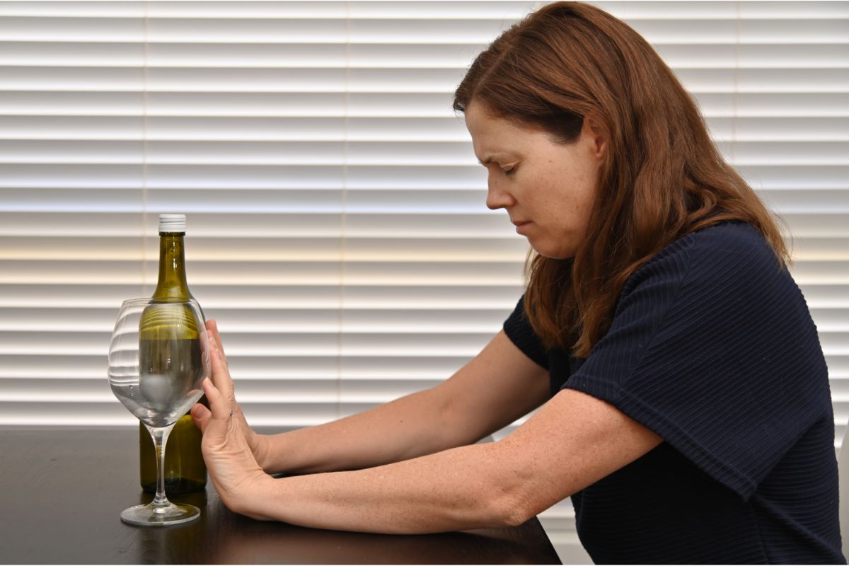 woman struggling with alcohol addiction decides to quit and go to detox